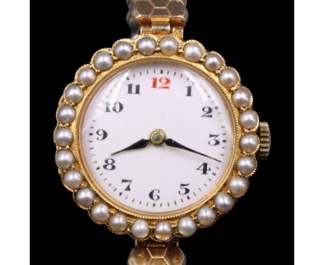 A lady's Rolex pearl-set 14 ct yellow metal dress wristwatch having a 15-jewel movement and white enamelled face with Arabic 