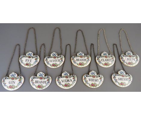 A set of twentieth century fine bone china Crown Staffordshire transfer-printed decanter labels. To include: Rye, Rum, Gin, B