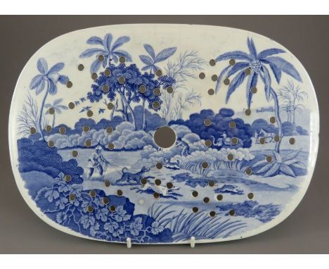 An early nineteenth century blue and white transfer-printed Spode Indian Sporting series drainer, c. 1815. It is marked to th