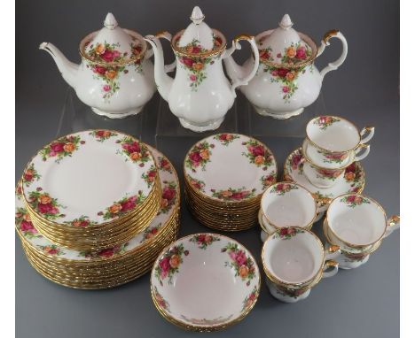An extensive Royal Albert Country Roses tea service, comprising of: eight cups and saucers, fourteen side plates, a coffeepot