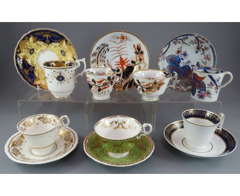 A group of early nineteenth century hand-painted mainly Spode porcelain cups and saucers and one trio, c. 1820-25. Saucers: 1