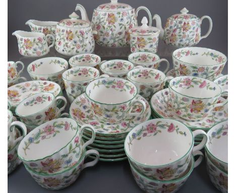 An extensive Minton Haddon Hall pattern tea service, comprising of: two teapots and covers, two covered sugars, two waste bow