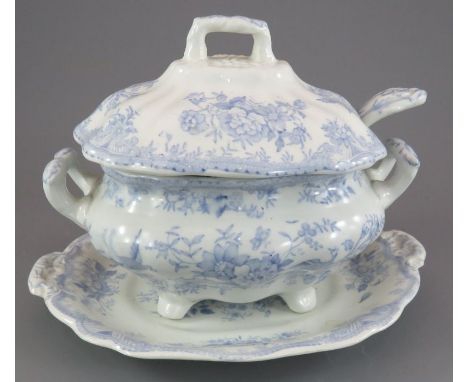 A mid-nineteenth century blue and white transfer-printed Wedgwood & Co. Asiatic Pheasant sauce tureen, cover, stand and ladle