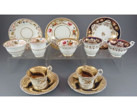 A group of early nineteenth century hand-painted mainly Spode porcelain cups and saucers, c. 1820-25. Saucers: 15 cm wide. (5