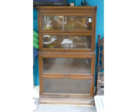 Globe Wernicke style 4 section oak bookcase, with glazed lifting fronts.  152cm high x 87cm wide.