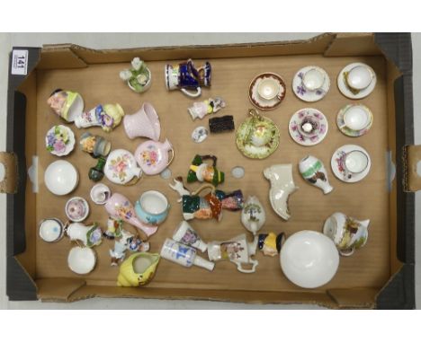 An interesting collection of mostly porcelain miniatures including Copeland Spode milk jug and sugar bowl, Spode miniature cu