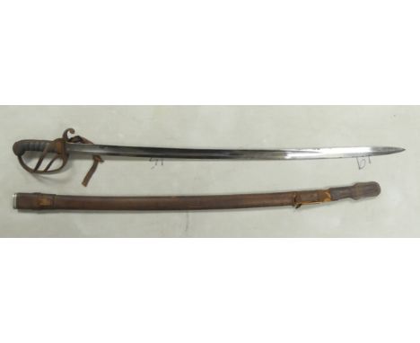 A 1796 British Type Light Cavalry Sabre in Leather Scabbard. Blade is engraved 'Thomas Bull / WYC'. Some signs of age and rus