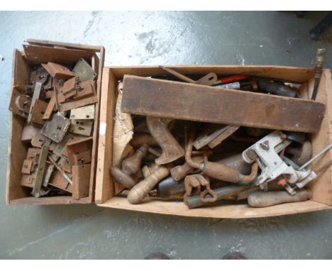A box of 19th century and later locks, with a box of vintage tools including plough plane, wrench and chisels
