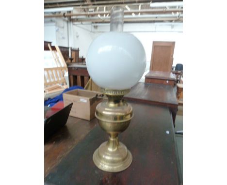 An early 20th century Duplex brass oil lamp, with chimney and shade, 52cmH