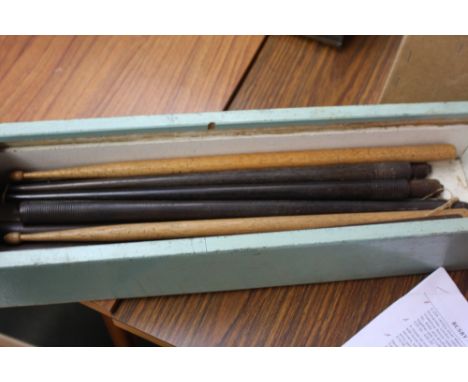 A box of vintage drum sticks