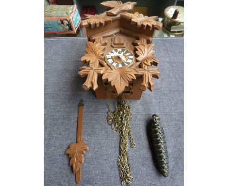 Bachmaier and Klemmer carved cuckoo clock with weight in the form of a pine cone with a Barometer
