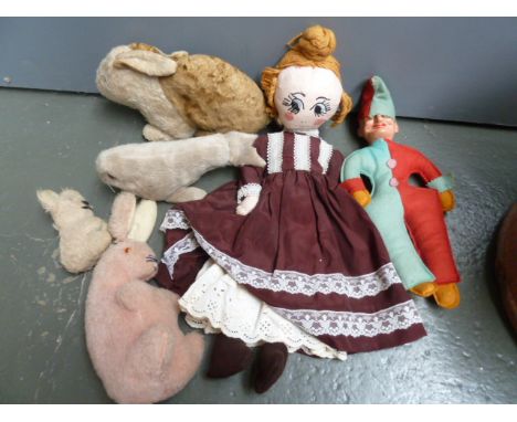 A collection of vintage toys to include a mohair bunny, a 'Mr Punch' doll with stuffed felt body and felt hat, a pink bunny (