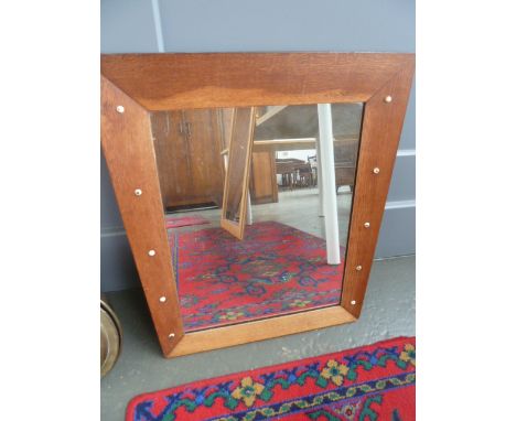A 1950's oak framed tapering mirror with enamel ball decoration to both sides, 55cmW x 63cmH