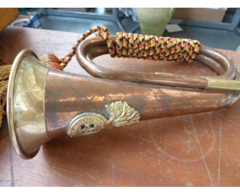 A copper and brass bugle, with later Royal Welsh Fusiliers badge