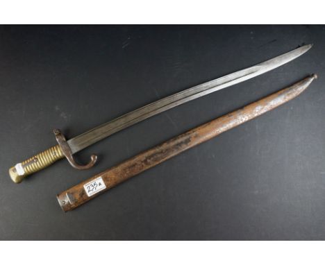 A French Model 1866 Chassepot Bayonet, Having A 57cm Yataghan Shaped Fullered Blade, The Hooked Quillon Numbered, With Ribbed