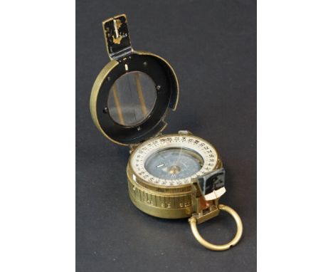 A World War Two British Military Marching Compass, Dated 1943 And Made By T.G.Co Ltd. London And Marked With The British Broa