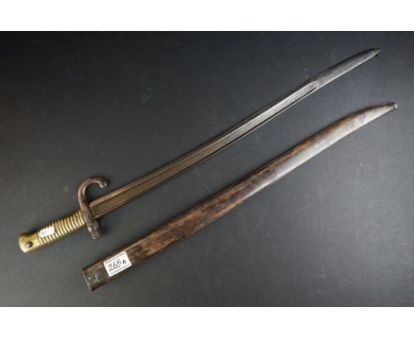 A French Model 1866 Chassepot Bayonet, Having A 57cm Yataghan Shaped Fullered Blade, The Hooked Quillon Numbered, With Ribbed