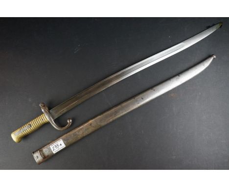 A French Model 1866 Chassepot Bayonet, Having A 57cm Yataghan Shaped Fullered Blade, The Hooked Quillon Numbered, With Ribbed