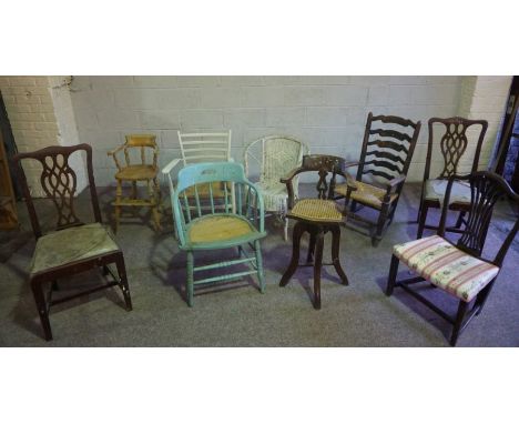 A large assortment of chairs, including a set of six Sheraton reproduction dining chairs, a ladder backed rocking chair, chil