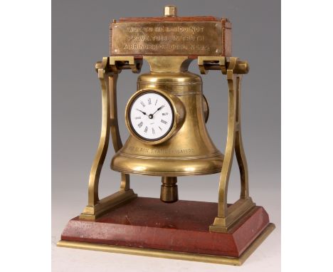 A LATE 19th CENTURY FRENCH INDUSTRIAL MANTEL CLOCK in the form of a ships bell on red marble base, now with modern battery mo