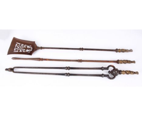 A SET OF THREE LATE GEORGIAN STEEL AND CAST BELL METAL FIRE TOOLS with seated greyhound handles and ringed facetted stems; co