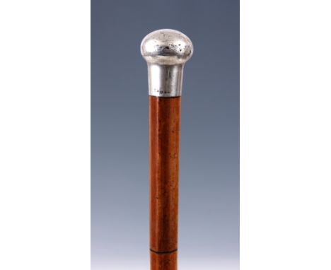 A LATE 19TH CENTURY MALLACCA SWORD STICK with silver handle and single edge steel blade 90cm overall