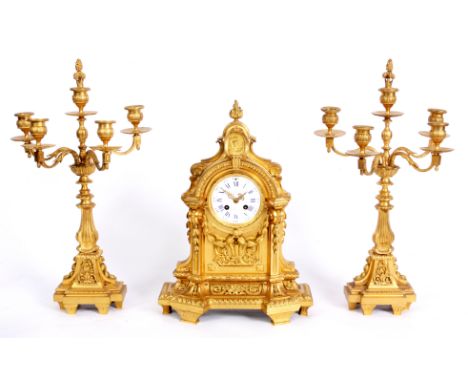 RAINGO-FRERES, PARIS   A MID 19TH CENTURY FRENCH GILT ORMOLU THREE PIECE CLOCK GARNITURE the ornate finely cast case with a c