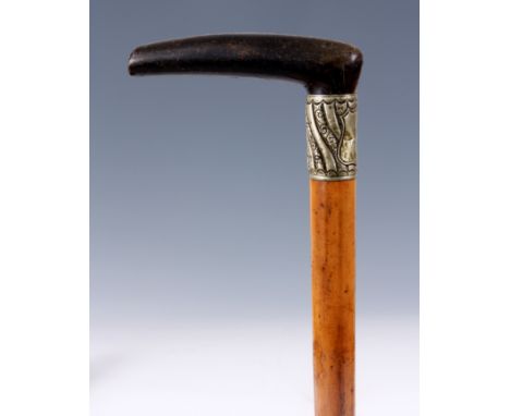 A LATE 19TH CENTURY RHINO HORN HANDLED WALKING STICK with Malacca cane 83cm overall.