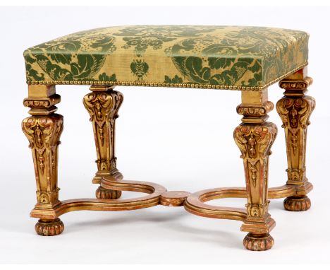 A LOUIS XVI STYLE GILT GESSO DRESSING STOOL with carved square tapering legs joined by an X shaped stretcher and standing on 