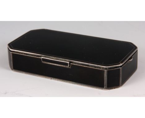 A 19TH CENTURY BLACK ENAMEL AND SILVERED METAL RECTANGULAR LADIES COMPACT with clipped corners and hinged lid revealing a mir