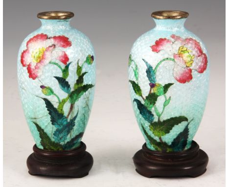 A PAIR OF JAPANESE ENAMEL SPILL VASES with turquoise graduated ground with pink flowers, hard wood bases and original lined b