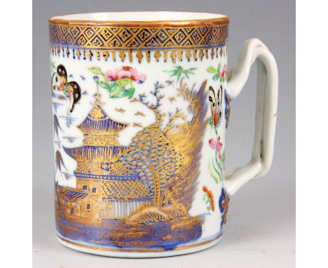 A 18TH CENTURY CHINESE EXPORT MUG with blue underglaze highlighted in gilt and enamel coloured flowers and butterflies 10.5cm