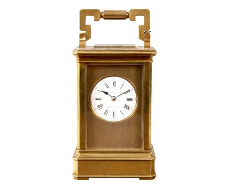 A LATE 19TH CENTURY FRENCH BRASS STRIKING CARRIAGE CLOCK having canted corners on a plinth base. The engine turned masked dia