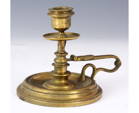 AN UNUSUAL EARLY 20TH CENTURY BRASS CHAMBER-STICK/WALL LIGHT with a patented hinged mechanism allowing change from a chamber 