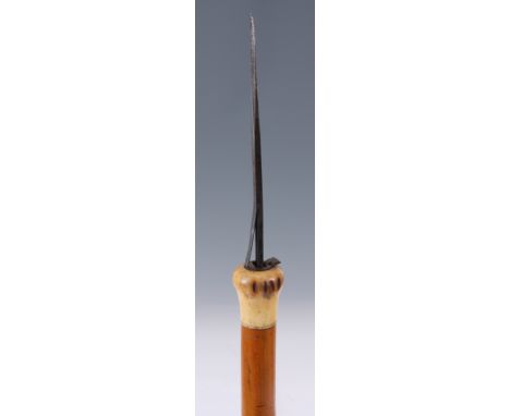 A LATE 19TH/ EARLY 20TH CENTURY ANGLO-INDIAN FLICK STICK with engraved gilt work blade, bone handle and cane shaft 89cm overa