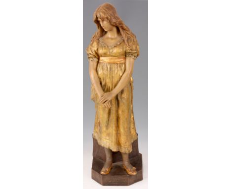 FREDERICK GOLDSCHEIDER, VIENNA a painted terracotta figure of a young lady; the base inscribed HEREADIE applied rectangular G