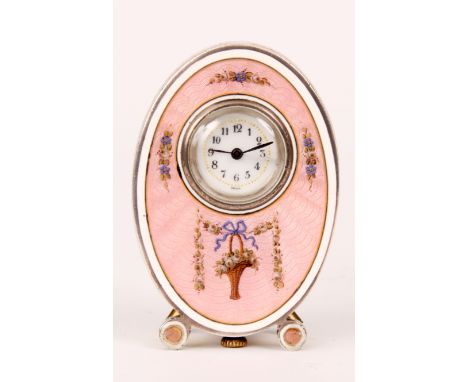 A SWISS LATE 19th CENTURY MINIATURE SILVER ENAMEL BOUDOIR CLOCK of oval form with swag work decoration suspending a hanging f