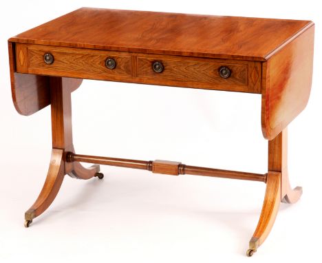 A REGENCY STYLE SATINWOOD CROSS-BANDED ROSEWOOD SOFA TABLE with hinged fold down leaves above a shallow frieze with fitted dr