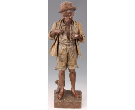 FREDERICK GOLDSCHEIDER, VIENNA a painted terracotta figure of a young boy standing next to a tree stump wearing hat and dishe
