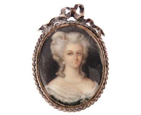 AN 18TH CENTURY MINIATURE PORTRAIT OF A YOUNG WOMAN well dressed with a pearl necklace in a silver metal frame surmounted by 