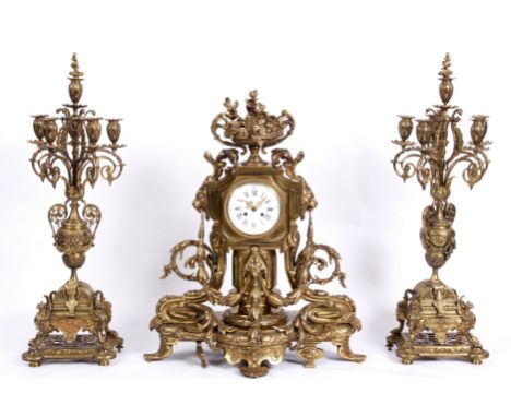 LE ROI, PARIS  A LARGE AND IMPRESSIVE LATE 19TH CENTURY FRENCH ORMOLU CLOCK GARNITURE the case with scrolling swags and acant