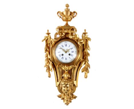 A 19TH CENTURY FRENCH LOUIS XVI STYLE GILT ORMOLU CARTEL CLOCK finely cast with a central urn and draping leaf-work side swag