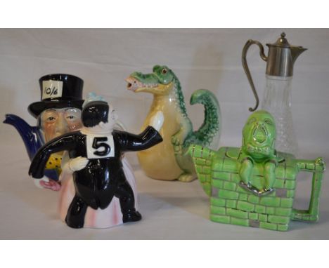 4 ceramic teapots including Mad Hatter, Humpty Dumpty, Alligator eating fish etc and a silver plate top claret jug