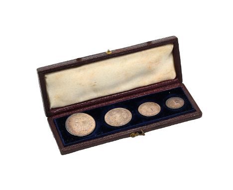 1860 silver four-coin Queen Victoria Maundy Money set in a contemporary long box with hook closure. Includes (1) 1860 Maundy 