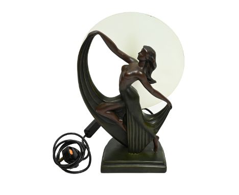 An Art Deco style resin lamp of a dancing lady, with a glass shade. 38cm high&nbsp;