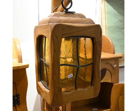 Late 20th century carved oak character shelved cabinet with lamp. The cabinet with carved eyes, booted feet and "arms". H 150