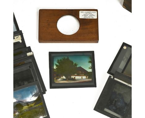 A large collection of magic lantern slides, including China, Switzerland, Austria, WWI, along with a magic lantern.