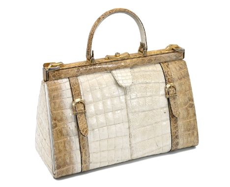 A vintage cream and brown crocodile skin handbag, with a brass push lock and straps and having suede interior, 36cm long and 