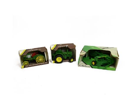 Boxed John Deere die-cast toy model Tractors: 1953 Model 'D'; 1915 Model 'R' Waterloo Boy; Model 1600 Mower conditioner.&nbsp