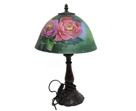 Two 20th century Tiffany style lamps, one with a metal base modelled as a tree trunk with a marbelled glass shade, the other 
